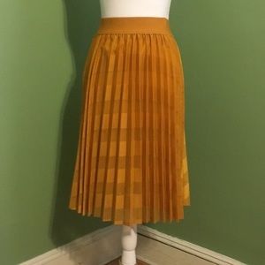 Gold pleated Metro Wear skirt knee length